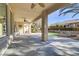 Covered patio with ceiling fans, extends to a grassy backyard at 10247 Santo Nina Ct, Las Vegas, NV 89135