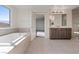 Bathroom with soaking tub and double vanity at 10409 Mont Pourri Ct, Las Vegas, NV 89149