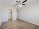 Bedroom with ceiling fan, closet, and wood-look flooring at 10409 Mont Pourri Ct, Las Vegas, NV 89149