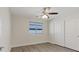 Bright bedroom featuring ceiling fan, large closet, and wood-look flooring at 10409 Mont Pourri Ct, Las Vegas, NV 89149