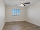 Bright bedroom with wood-look floors and window blinds at 10409 Mont Pourri Ct, Las Vegas, NV 89149