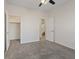 Spacious bedroom with ceiling fan, walk-in closet, and carpet flooring at 10409 Mont Pourri Ct, Las Vegas, NV 89149