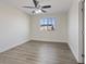 Bright bedroom with ceiling fan and wood-look flooring at 10409 Mont Pourri Ct, Las Vegas, NV 89149