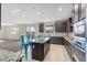 Modern kitchen with granite countertops and island at 10409 Mont Pourri Ct, Las Vegas, NV 89149