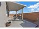 Covered patio with grill and side yard view at 10409 Mont Pourri Ct, Las Vegas, NV 89149