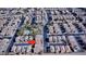 Aerial view of a neighborhood street with desert landscaping and community pool nearby at 10452 Prairie Schooner Ave, Las Vegas, NV 89129