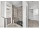 Modern bathroom with a tiled walk-in shower, bench, and glass enclosure at 10452 Prairie Schooner Ave, Las Vegas, NV 89129