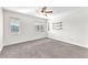 Bright bedroom featuring new carpet, multiple windows, and built-in shelving at 10452 Prairie Schooner Ave, Las Vegas, NV 89129