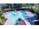 Overhead view of a uniquely shaped community pool with a rock waterfall feature at 10452 Prairie Schooner Ave, Las Vegas, NV 89129