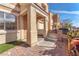 Warm front entrance with desert landscaping, covered porch and easy access to the garage at 10452 Prairie Schooner Ave, Las Vegas, NV 89129