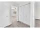 Hallway with a view into the bedroom showcasing a ceiling fan and closet at 10452 Prairie Schooner Ave, Las Vegas, NV 89129