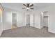 Spacious main bedroom featuring plush carpet, with doorways to the bathroom and closet at 10452 Prairie Schooner Ave, Las Vegas, NV 89129