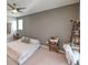 Main bedroom with king-size bed, a neutral color palette, and ample space at 10640 Skye Scout Ave, Las Vegas, NV 89166