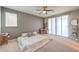 Main bedroom with a king-size bed and access to a private balcony at 10640 Skye Scout Ave, Las Vegas, NV 89166