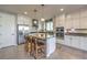 Modern kitchen with white cabinets, large island, and stainless steel appliances at 10640 Skye Scout Ave, Las Vegas, NV 89166