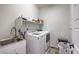 Clean laundry room with washer, dryer and utility sink at 10640 Skye Scout Ave, Las Vegas, NV 89166