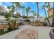 Landscaped backyard with stone patio and pool at 10779 Crown Ct, Las Vegas, NV 89141