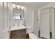 Clean bathroom with a walk-in shower, toilet, and wood vanity at 10779 Crown Ct, Las Vegas, NV 89141