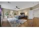 Main bedroom with large windows, walk-in closet, and wood floors at 10779 Crown Ct, Las Vegas, NV 89141