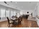 Bright dining room with hardwood floors, a large table, and views of the kitchen at 10779 Crown Ct, Las Vegas, NV 89141