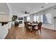 Formal dining room with hardwood floors and large windows at 10779 Crown Ct, Las Vegas, NV 89141