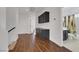 Long hallway with dark wood cabinets and a bathroom to the right at 10779 Crown Ct, Las Vegas, NV 89141