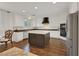 Bright kitchen featuring an island, hardwood floors, and white cabinetry at 10779 Crown Ct, Las Vegas, NV 89141