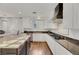 Modern kitchen with white cabinets, granite counters, and a large island at 10779 Crown Ct, Las Vegas, NV 89141