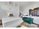 Open living area with hardwood floors, a built-in bookcase, and a grand piano at 10779 Crown Ct, Las Vegas, NV 89141