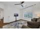 Bright sitting room featuring a sofa, large TV, and hardwood floors at 10779 Crown Ct, Las Vegas, NV 89141