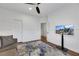 Sitting room with large TV, sofa and hardwood floors at 10779 Crown Ct, Las Vegas, NV 89141