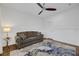 Cozy sitting room with a sofa and hardwood floors at 10779 Crown Ct, Las Vegas, NV 89141