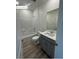 Bathroom with a shower/tub combo and modern gray vanity at 1521 Bat Hawk St, Las Vegas, NV 89138