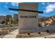 Entrance sign of Quail Cove community, new homes surrounded by desert landscape at 1521 Bat Hawk St, Las Vegas, NV 89138