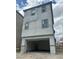Modern three-story home with a two car garage and stucco exterior at 1521 Bat Hawk St, Las Vegas, NV 89138