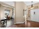 Bright and spacious entryway with tile flooring, office space and built-in shelving at 1715 Mesquite Ct, Henderson, NV 89014