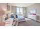 Light and airy bedroom with pink accent wall and desk area at 1921 Lewis Bay Ave # Lot 21, North Las Vegas, NV 89084