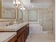 Elegant bathroom with double sinks, soaking tub, and separate shower at 20 Via Mantova # 309, Henderson, NV 89011