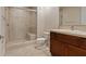 Clean bathroom with shower, toilet and wood vanity at 20 Via Mantova # 309, Henderson, NV 89011