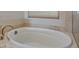 Oval soaking tub perfect for relaxation in this spa-like bathroom at 20 Via Mantova # 309, Henderson, NV 89011