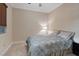 Cozy bedroom with a floral comforter and plenty of natural light at 20 Via Mantova # 309, Henderson, NV 89011