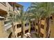 View of a charming courtyard with tropical landscaping at 20 Via Mantova # 309, Henderson, NV 89011