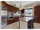 Kitchen with center island and stainless steel appliances at 20 Via Mantova # 309, Henderson, NV 89011