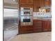 Modern kitchen with stainless steel appliances and cabinetry at 20 Via Mantova # 309, Henderson, NV 89011