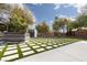 Landscaped backyard with artificial turf and a shed at 2000 Catalina Marie Ave, Henderson, NV 89074