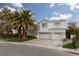 Two-story house with palm trees and attached two-car garage at 2000 Catalina Marie Ave, Henderson, NV 89074