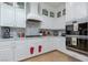 Bright kitchen with white cabinets, marble countertops and stainless steel appliances at 2000 Catalina Marie Ave, Henderson, NV 89074