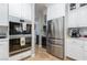 Spacious kitchen with stainless steel appliances and white cabinets at 2000 Catalina Marie Ave, Henderson, NV 89074