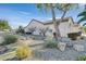 Landscaped backyard with putting green and patio at 2050 Cambridge Springs Dr, Henderson, NV 89052