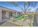 Covered patio and putting green in backyard at 2050 Cambridge Springs Dr, Henderson, NV 89052